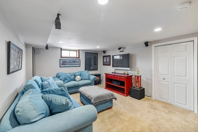 carpeted living area featuring recessed lighting