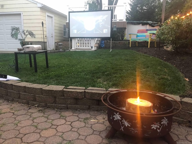 view of yard with an outdoor fire pit