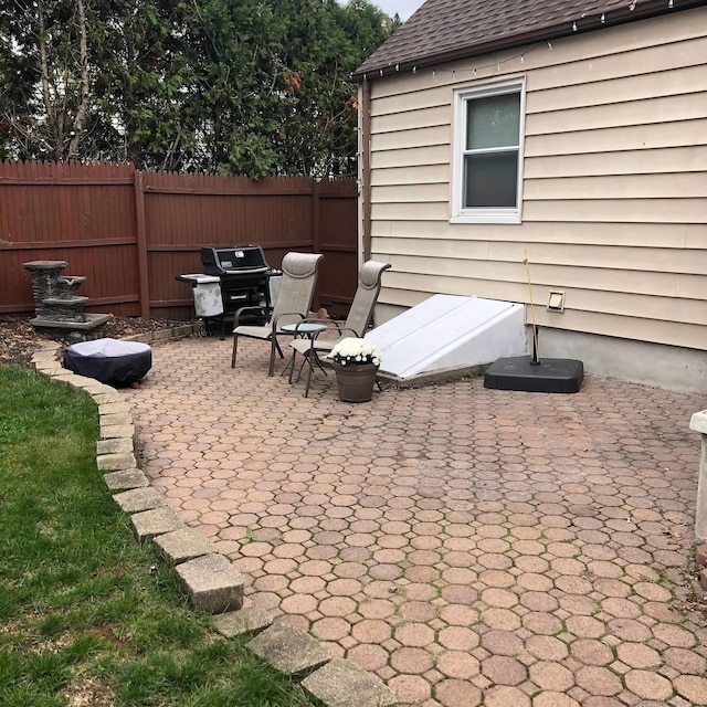 view of patio / terrace with fence and grilling area