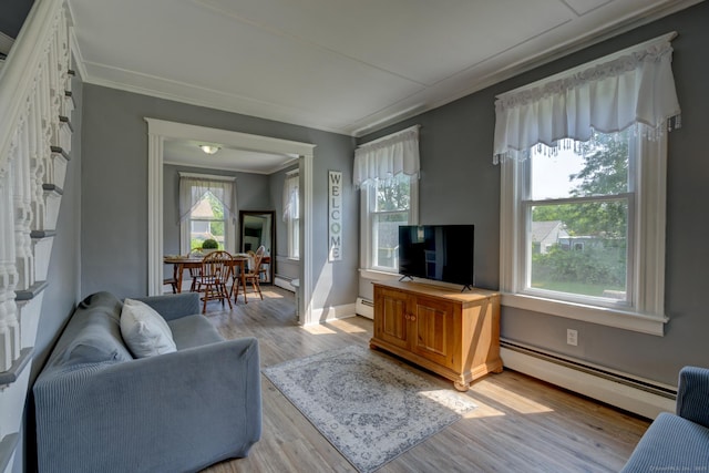 9 Crown St, Middletown, CT 06457 - living area with baseboard heating, wood finished floors, and crown molding