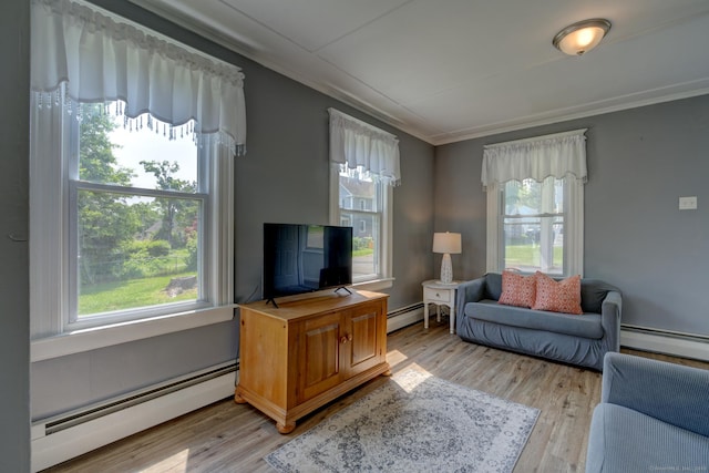 9 Crown St, Middletown, CT 06457 - living room with a baseboard radiator, plenty of natural light, light wood-style flooring, and crown molding