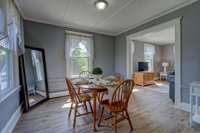 9 Crown St, Middletown, CT 06457 - dining area with healthy amount of natural light, wood finished floors, crown molding, and baseboard heating