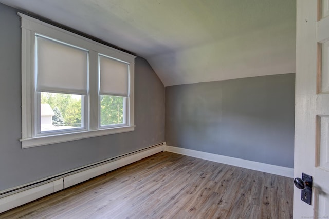9 Crown St, Middletown, CT 06457 - additional living space featuring a baseboard heating unit, wood finished floors, and vaulted ceiling