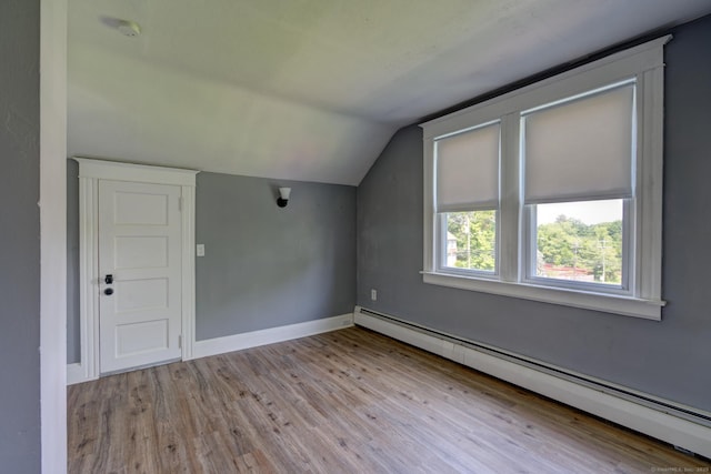 9 Crown St, Middletown, CT 06457 - additional living space featuring baseboard heating, lofted ceiling, and wood finished floors