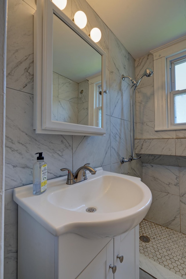 9 Crown St, Middletown, CT 06457 - bathroom featuring vanity, tile walls, and a shower