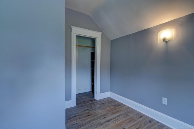 9 Crown St, Middletown, CT 06457 - unfurnished bedroom with lofted ceiling, wood finished floors, and a closet
