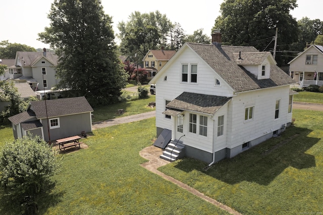 9 Crown St, Middletown, CT 06457 - back of property with a yard, a chimney, entry steps, a storage shed, and roof with shingles