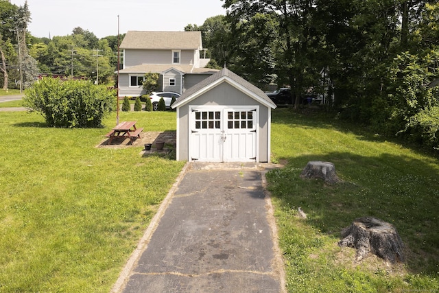9 Crown St, Middletown, CT 06457 - view of green lawn featuring a shed and asphalt driveway
