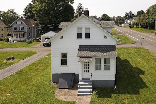 9 Crown St, Middletown, CT 06457 - rear view of house with a shingled roof, a yard, and a chimney