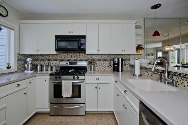 kitchen with stainless steel appliances, light countertops, and a sink