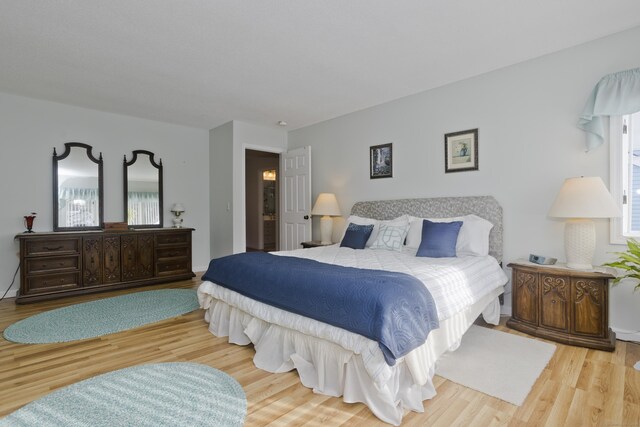 bedroom with wood finished floors