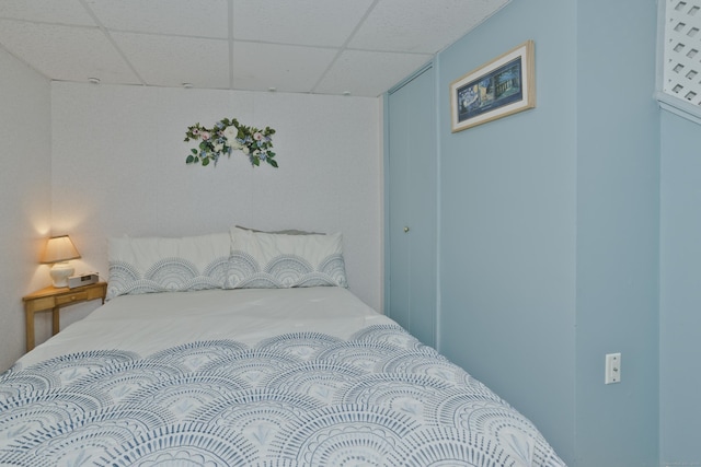 bedroom featuring a drop ceiling