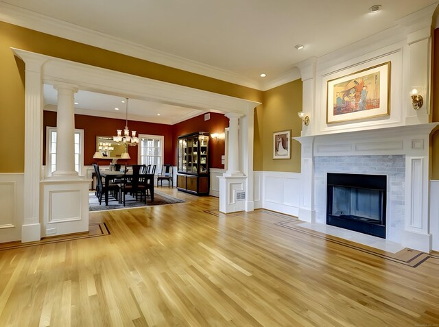 1 Wentworth Park, Farmington, CT 06032 - living room featuring a decorative wall, light wood-style floors, wainscoting, ornamental molding, and decorative columns