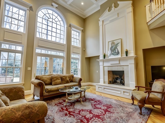 1 Wentworth Park, Farmington, CT 06032 - living area with a high ceiling, a tiled fireplace, ornamental molding, light wood finished floors, and beamed ceiling