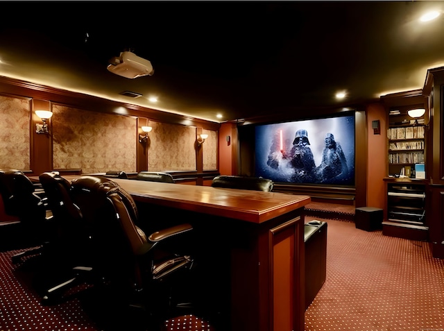 cinema room with visible vents and carpet floors