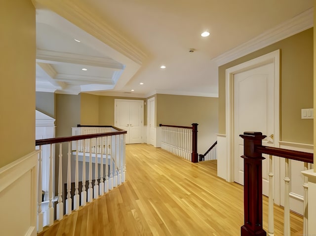 hallway with light wood-style flooring, recessed lighting, an upstairs landing, and ornamental molding