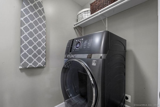 laundry room featuring washer / clothes dryer and laundry area