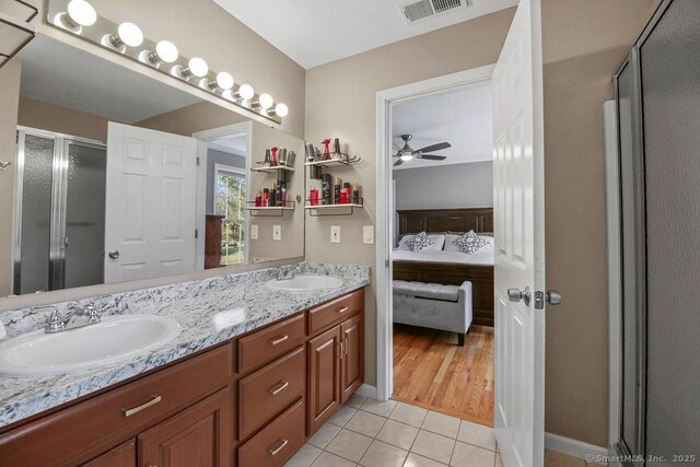 full bathroom featuring tile patterned floors, visible vents, ensuite bathroom, and a sink