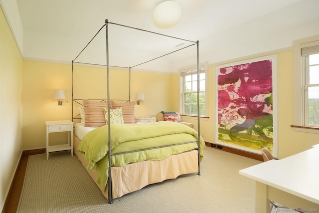 bedroom with carpet floors and baseboards