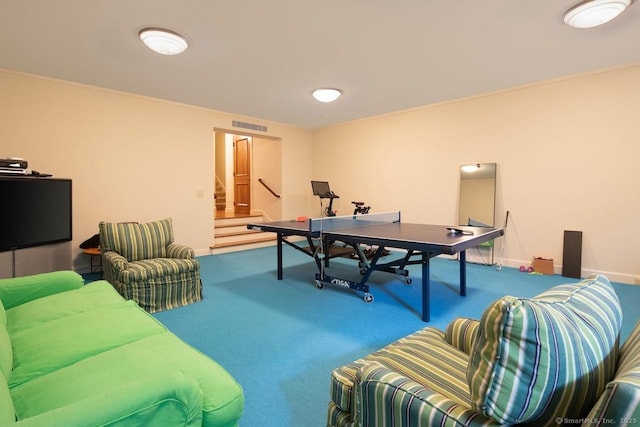 rec room with carpet flooring, visible vents, and baseboards