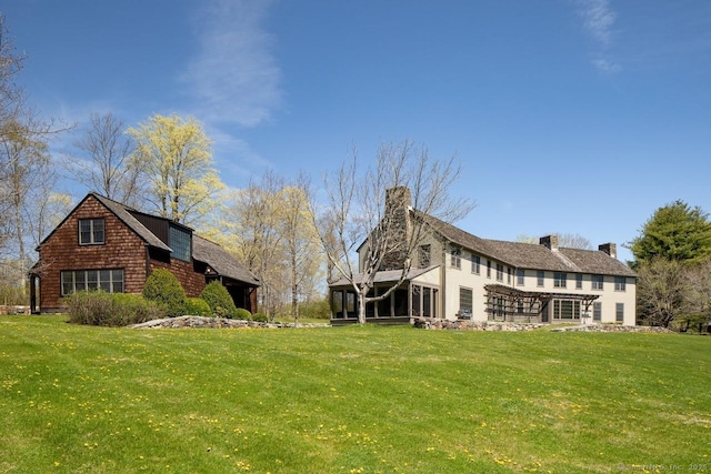11 Valley Rd, Salisbury, CT 06039 - exterior space featuring a sunroom, a chimney, and a yard