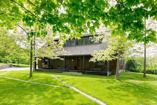 11 Valley Rd, Salisbury, CT 06039 - rear view of house featuring roof with shingles, a yard, and a porch