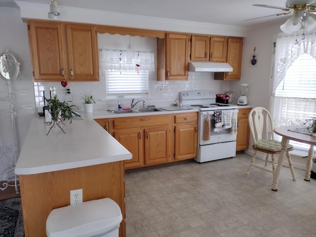 kitchen with white range with electric cooktop, light countertops, decorative backsplash, a sink, and under cabinet range hood