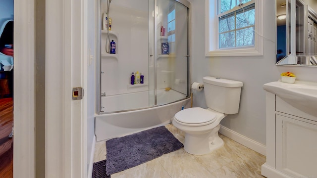 full bath with shower / bath combination with glass door, vanity, toilet, and baseboards