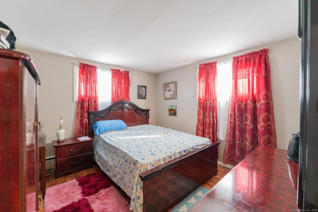 bedroom with wood finished floors