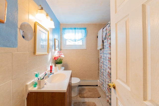 full bathroom with tile walls, toilet, baseboard heating, vanity, and tile patterned floors