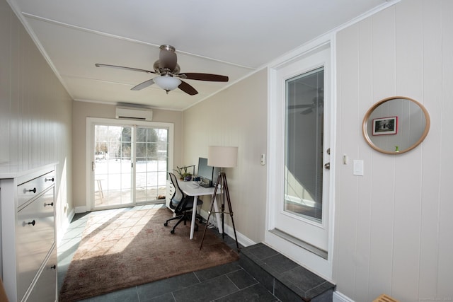 office with a wall unit AC, dark tile patterned floors, ornamental molding, and a ceiling fan