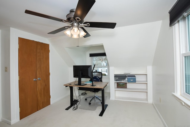 office with lofted ceiling, carpet flooring, and baseboards