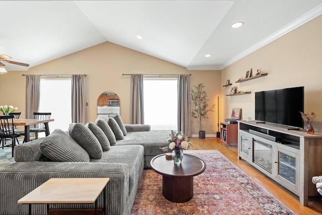 living room featuring lofted ceiling, recessed lighting, ceiling fan, light wood-type flooring, and baseboards