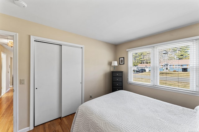 bedroom with a closet and wood finished floors