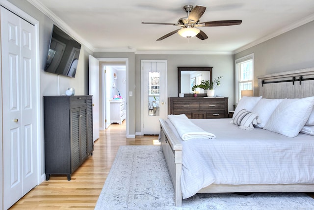 bedroom featuring ornamental molding, baseboards, ceiling fan, and light wood finished floors