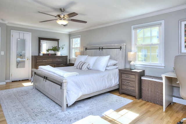 bedroom with multiple windows, crown molding, and light wood-style flooring