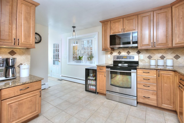 kitchen featuring stainless steel appliances, a baseboard heating unit, light stone counters, and light tile patterned flooring