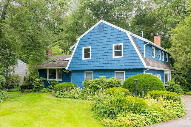 30 Holly Cir, Windsor, CT 06095 - view of side of property featuring a gambrel roof, a chimney, a yard, and roof with shingles