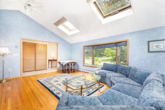 30 Holly Cir, Windsor, CT 06095 - living room featuring a skylight, wallpapered walls, high vaulted ceiling, wood finished floors, and a baseboard radiator