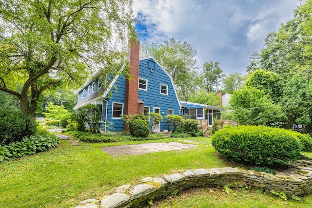 30 Holly Cir, Windsor, CT 06095 - view of home's exterior featuring a chimney and a lawn