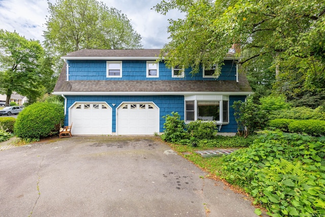 30 Holly Cir, Windsor, CT 06095 - view of front of home featuring driveway, a garage, and roof with shingles