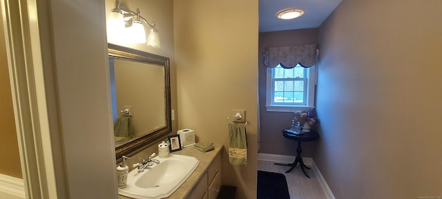 bathroom featuring vanity and baseboards