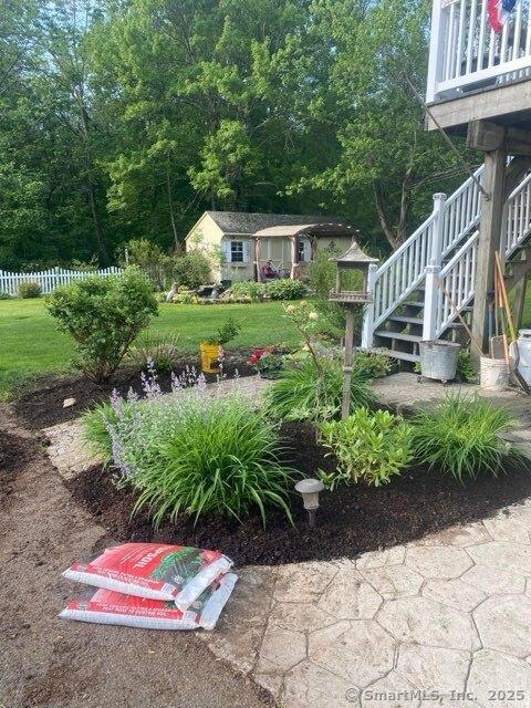 view of yard featuring stairs and fence