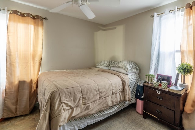 carpeted bedroom featuring ceiling fan