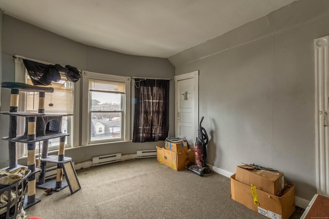 misc room featuring carpet floors, a baseboard radiator, a baseboard heating unit, and baseboards