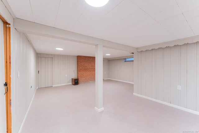 finished basement with carpet floors and baseboards