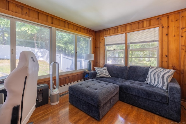 living room with wood walls and hardwood / wood-style floors