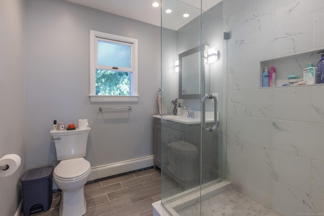 bathroom with baseboards, toilet, a baseboard radiator, vanity, and a shower stall