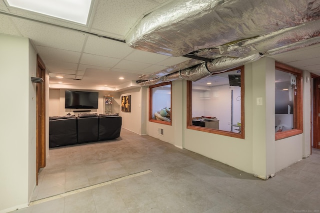 finished basement with a drop ceiling and visible vents