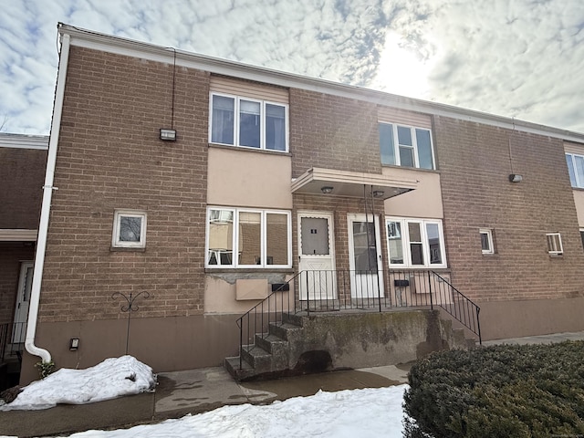 view of front of house featuring brick siding